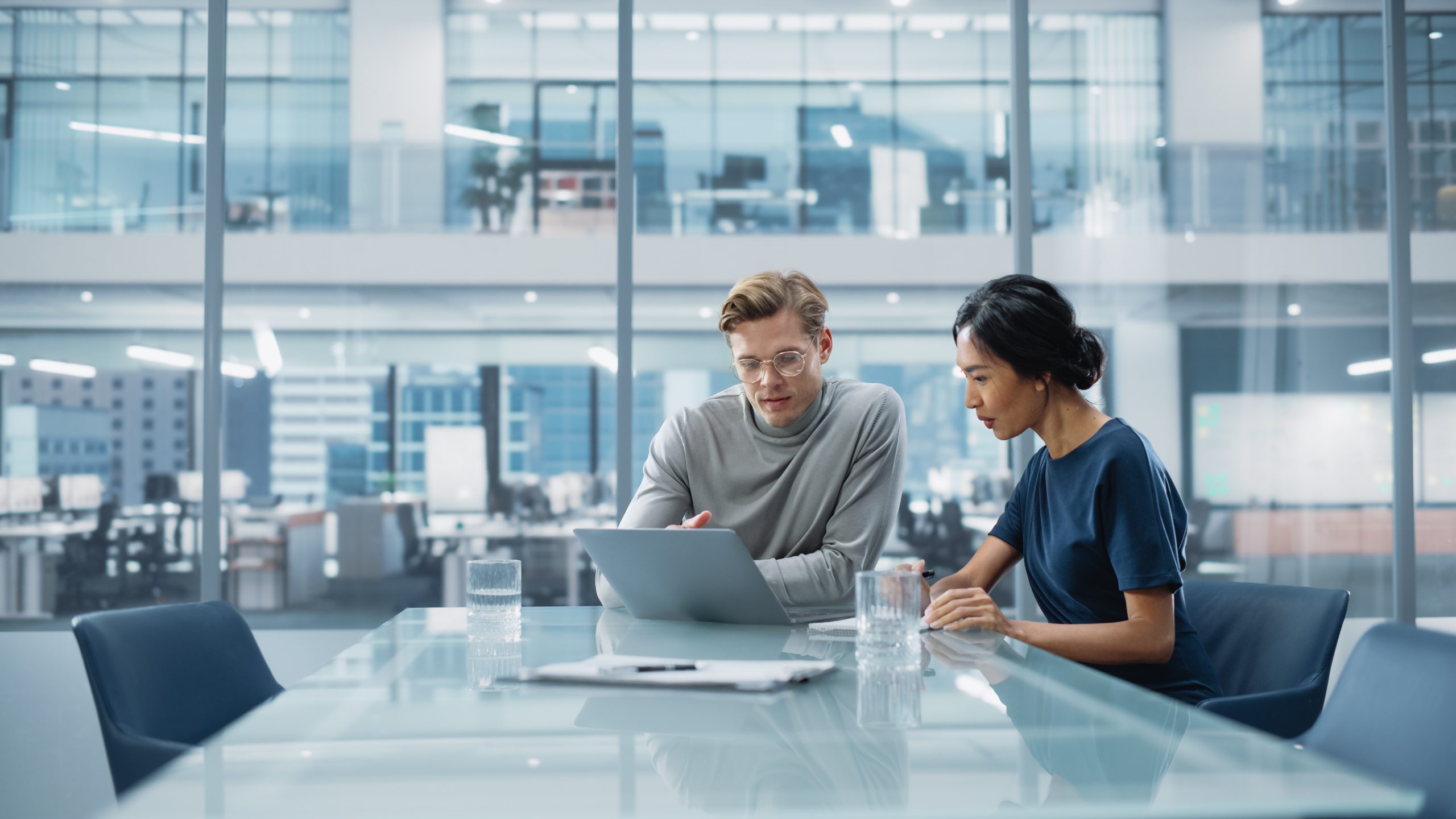 two people in a meeting room